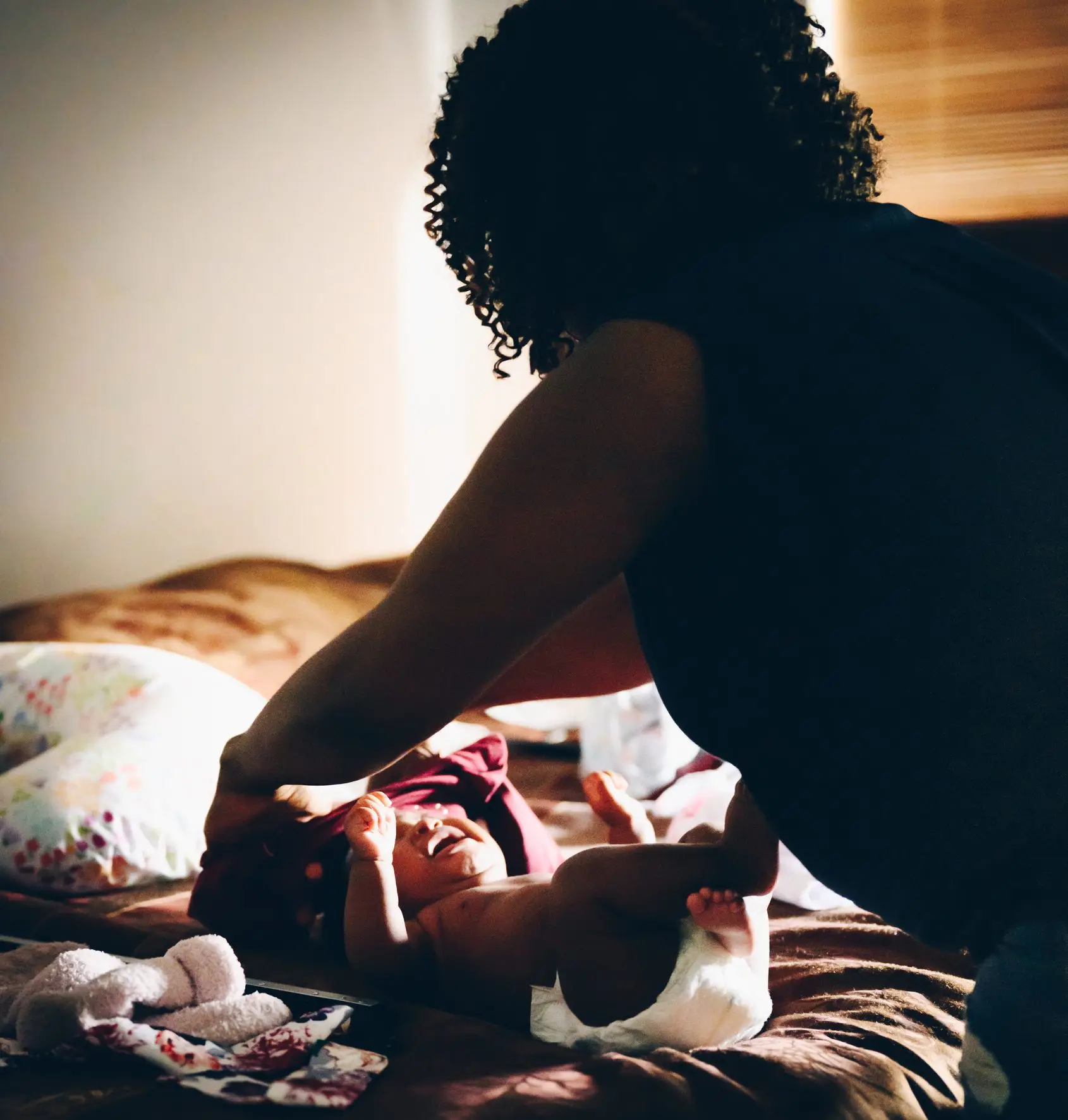 Black mother dresses and gets her babys hair ready real life parenting a newborn at The ultimate self care for moms
