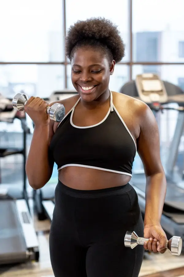 smiley woman training with mama approved fitness gear for moms
